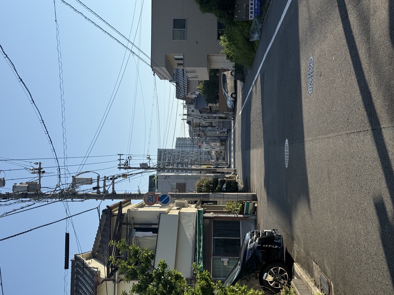 Narrow ivy-covered alley between old houses in Hiroshima