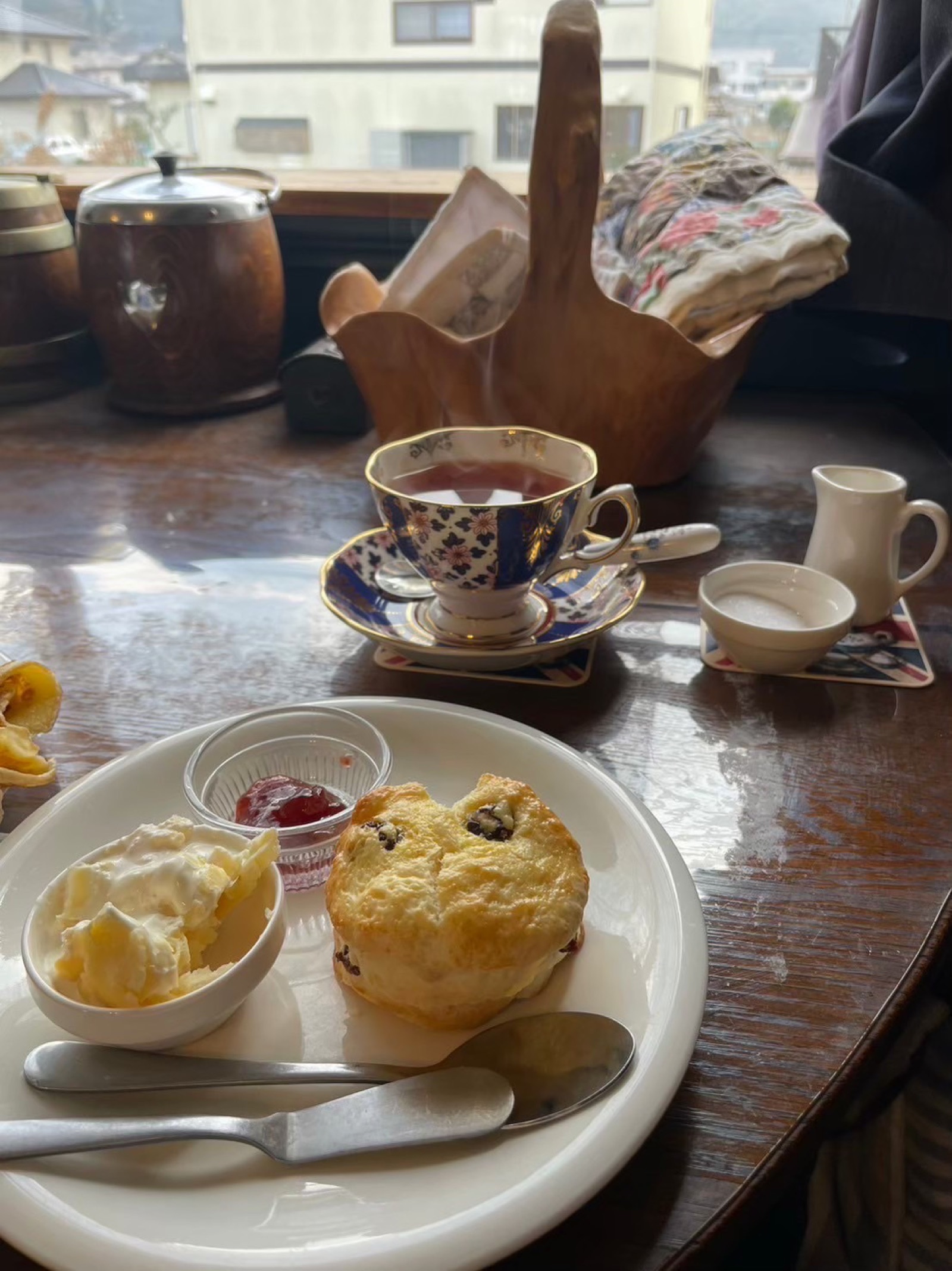 Scones and tea service overlooking the Hiroshima cityscape
