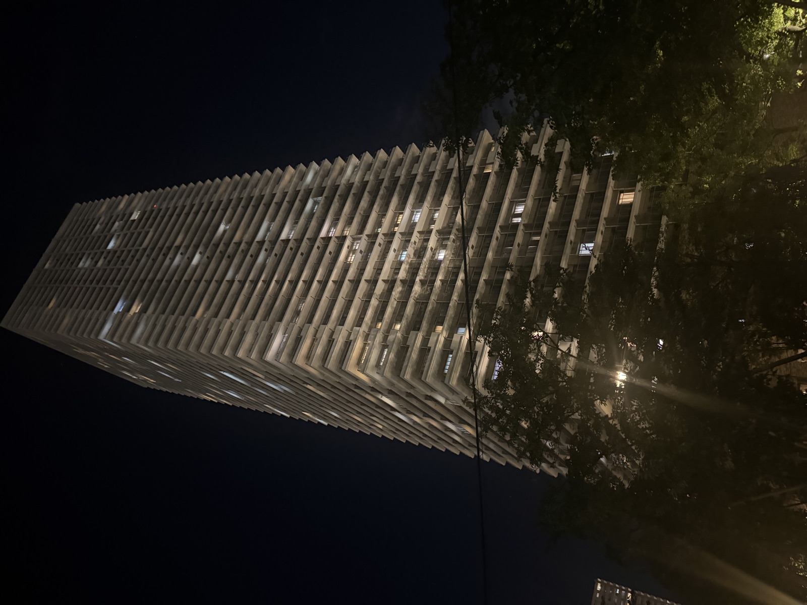 Modern building facade illuminated at night in Hiroshima